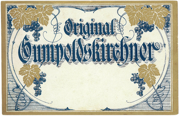 Ein altes deutsches Wein-Etikett mit einer Abbildung von Trauben und Blättern und einem Text, der den Wein-Typ angibt.