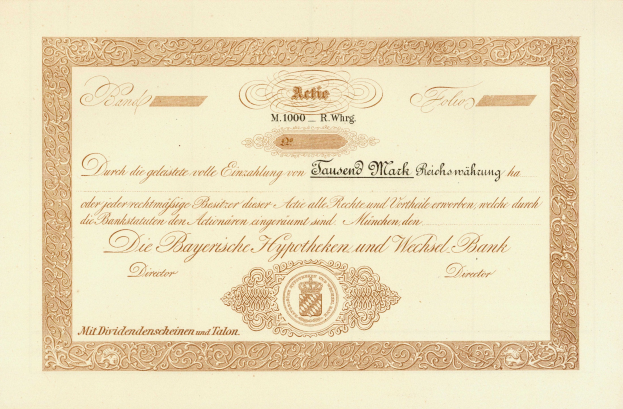 Altes Aktienzertifikat mit goldenem Rand, das ein Porträt eines Mannes und Text zeigt.