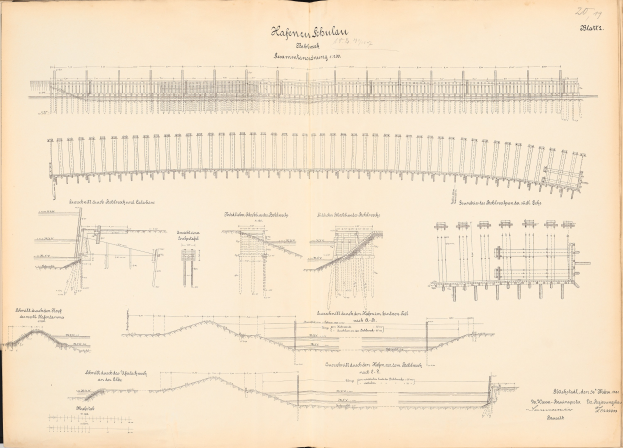 Detailzeichnung einer Eisenbahnschiene auf Papier, einschließlich Schienen, Lokomotiven und anderen Komponenten, begleitet von erklärendem Text.